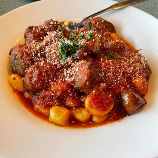 Baldo's Restaurant's Italian gnocchi with meatballs, rich tomato sauce, Parmesan cheese, and parsley.